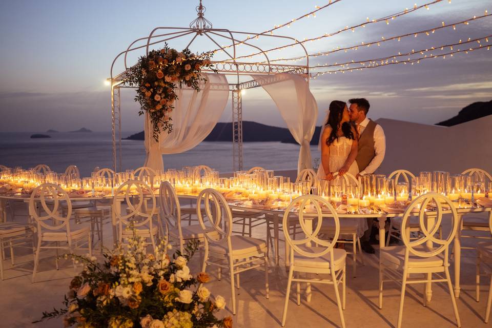 bride and groom kiss at their destination wedding santorini