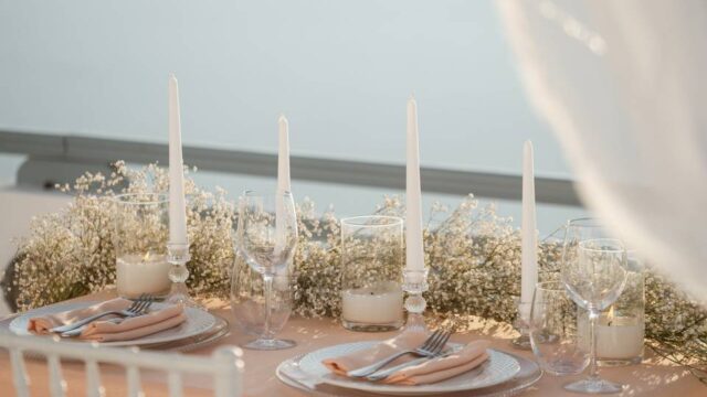a beautifully decorated table for a wedding in greece