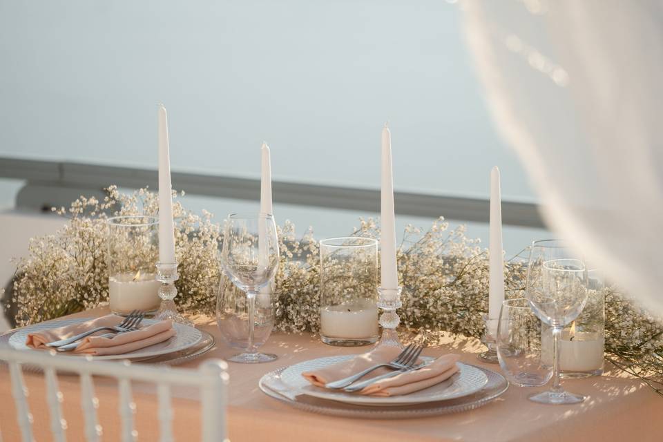 a beautifully decorated table for a wedding in greece
