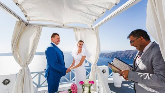 bride and groom getting married at a destination wedding santorini