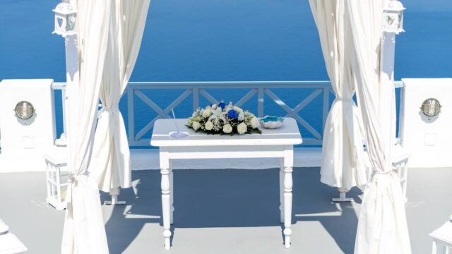 a ceremony table setup for a wedding in greece