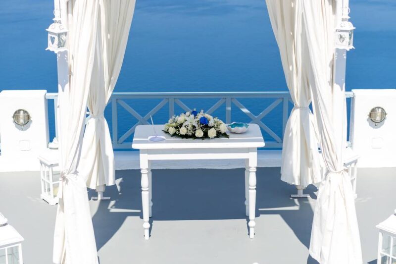 a ceremony table setup for a wedding in greece