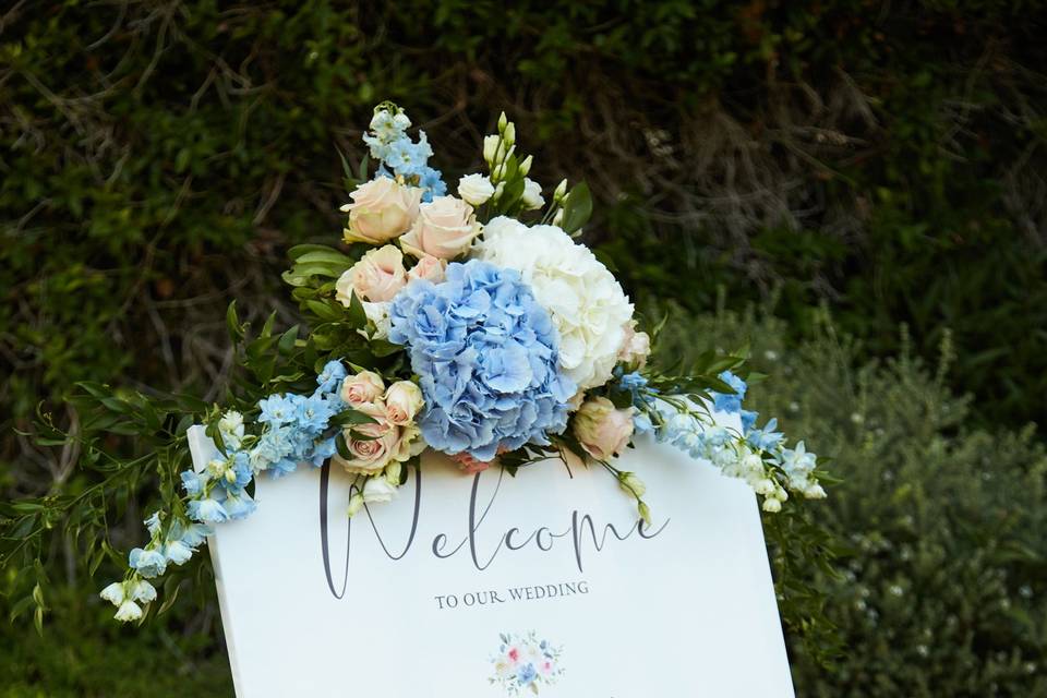 a greek wedding welcome sign