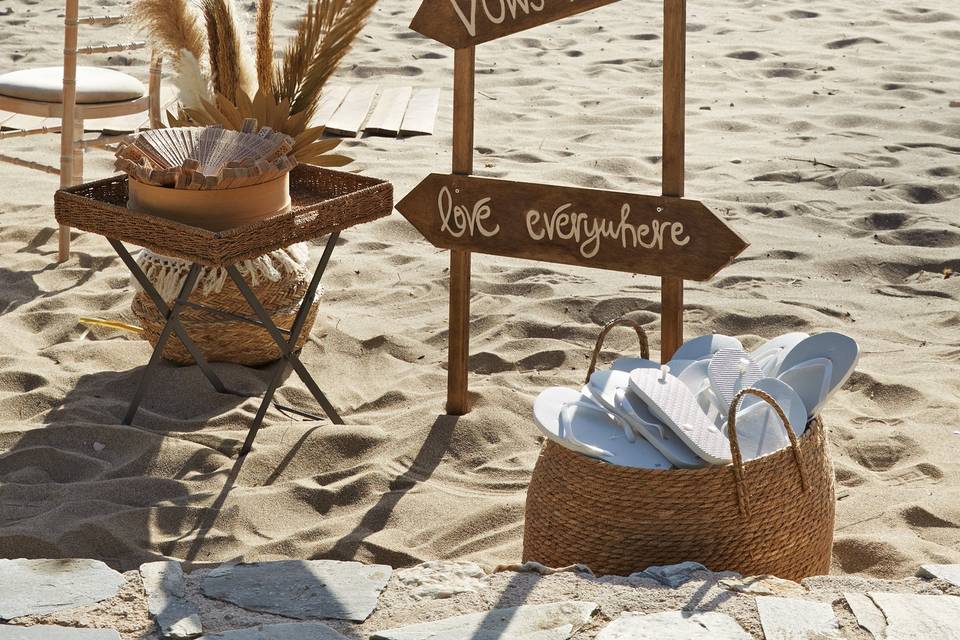 a basket and setup for a beach wedding in greece