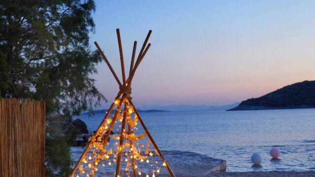 a wedding teepee with string lights