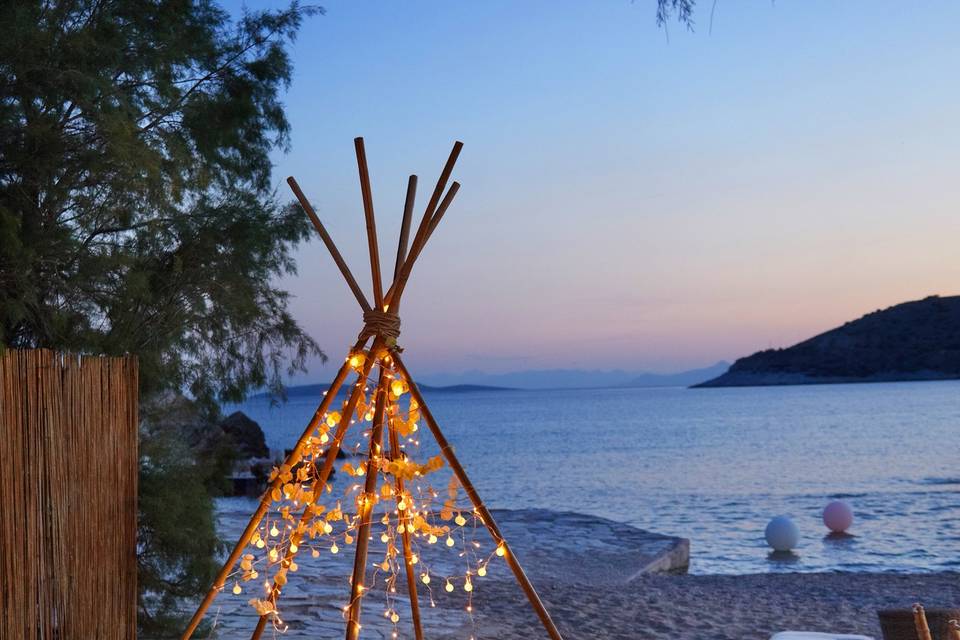a wedding teepee with string lights