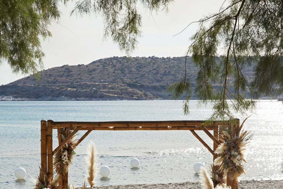 a wedding arch with flowers in greece