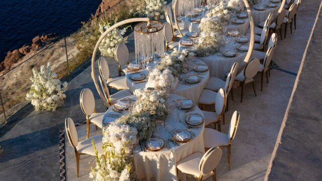 long wedding table with a sea view at a santorini wedding