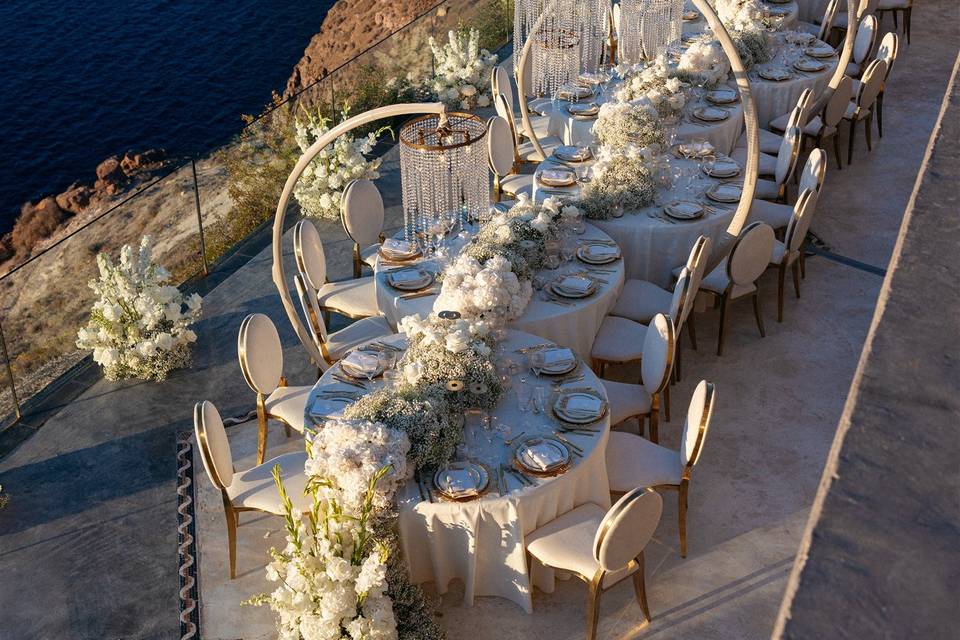 long wedding table with a sea view at a santorini wedding