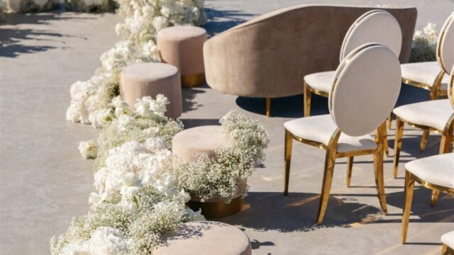 white flowers and chairs in santorini