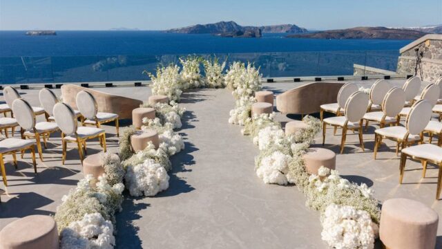 santorini wedding aisle with flowers