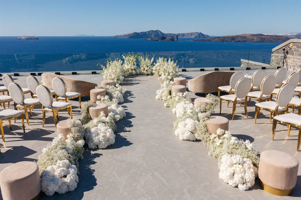 santorini wedding aisle with flowers