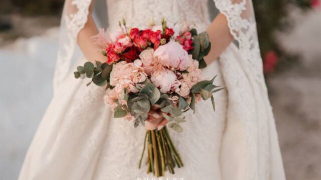 a bride holding a flower bouquet