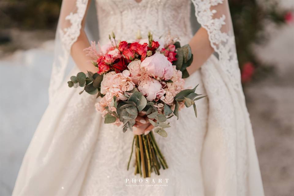 a bride holding a flower bouquet