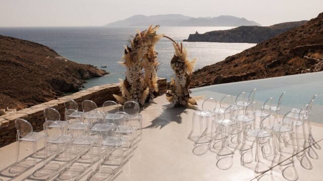 imposing view of a wedding arch overlooking the santorini caldera