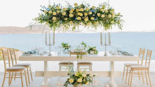 a wedding table set with a view over the greek aegean sea