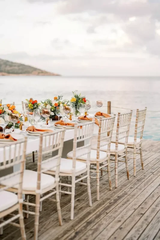a beautiful table setting with a view over the aegean sea for a greece destination wedding
