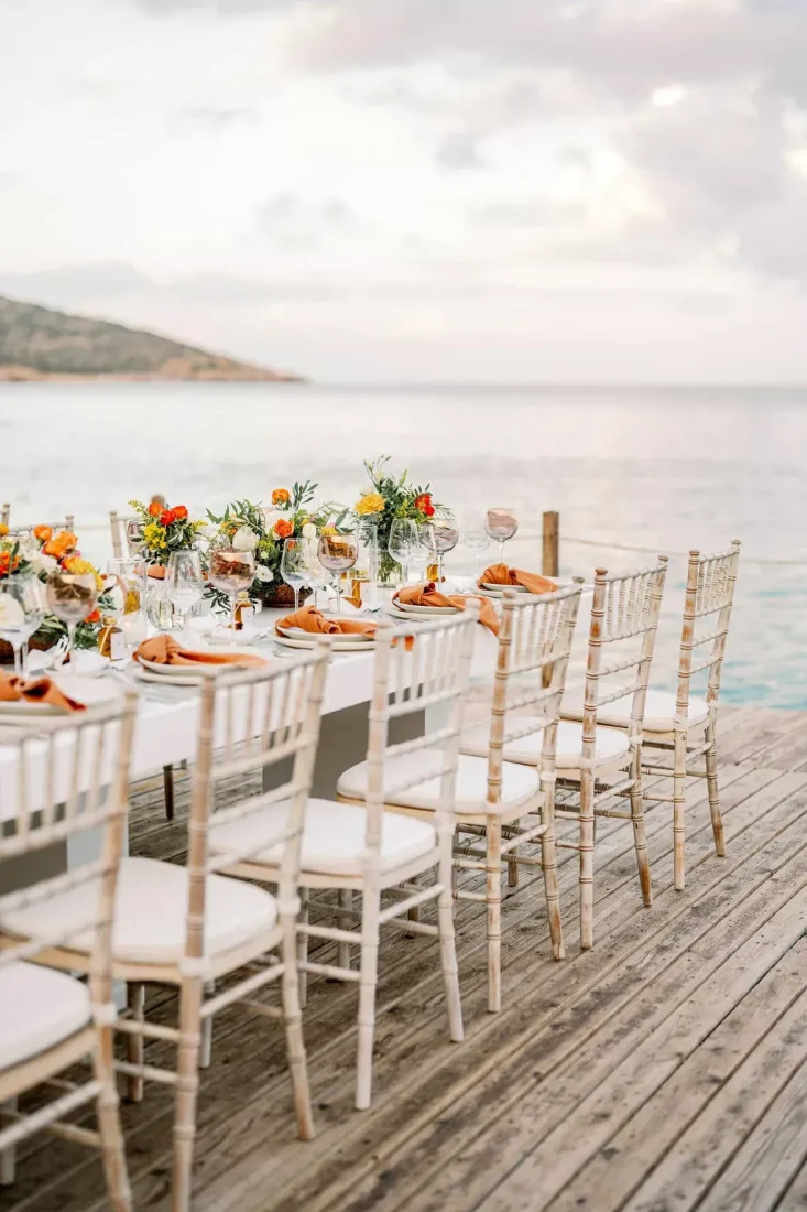 a beautiful table setting with a view over the aegean sea for a greece destination wedding