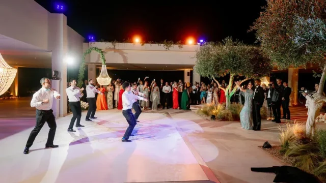 people dancing at a greek wedding reception