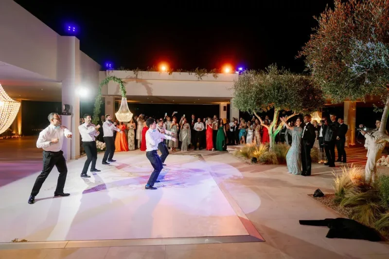 people dancing at a greek wedding reception