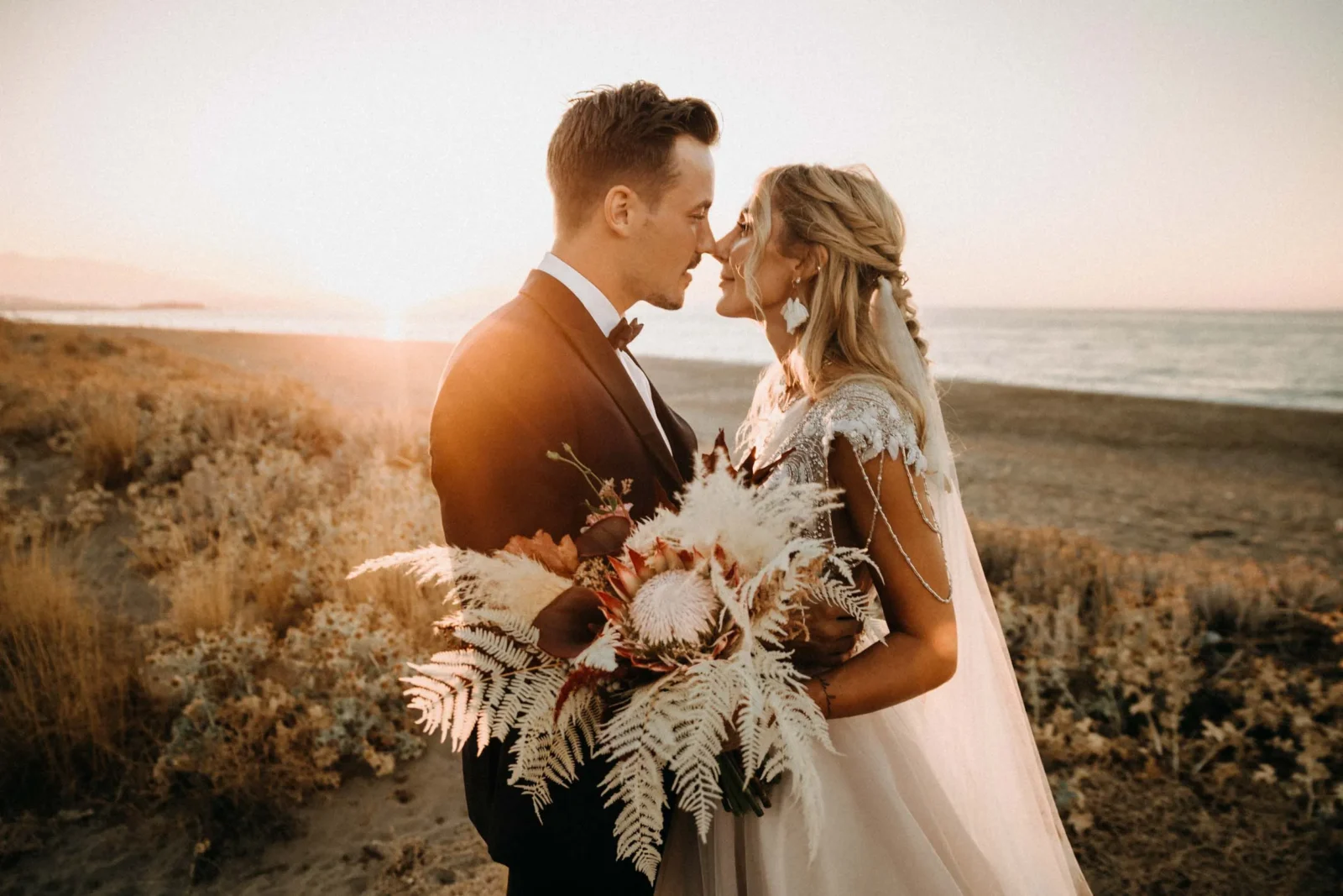 intimate wedding of a couple eloping in greece crete standing on the beach