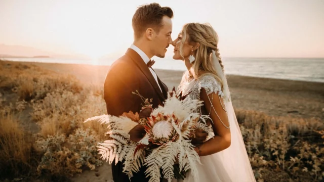 intimate wedding of a couple eloping in greece crete standing on the beach