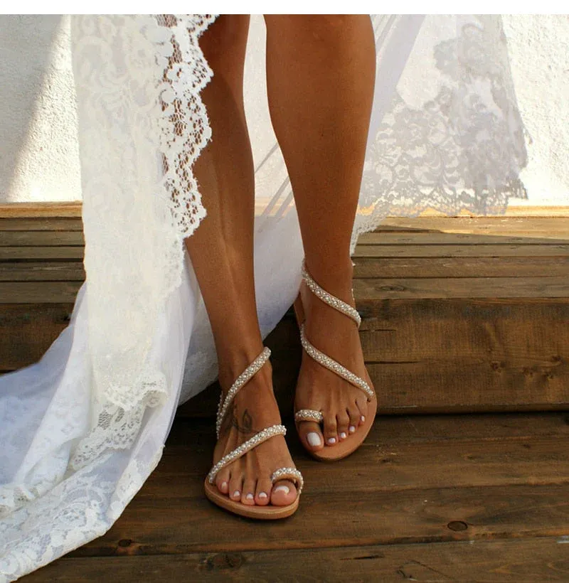 ancient greece style sandals with elegantly adorned leather straps with jewels and pearls