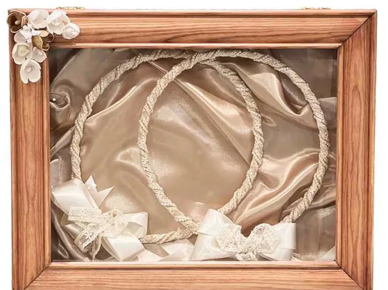 a Greek wedding stefana in a stefanothiki wooden frame for display