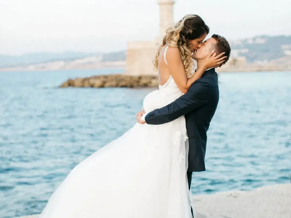 a newlywed couple eloping in greece at chania old harbor