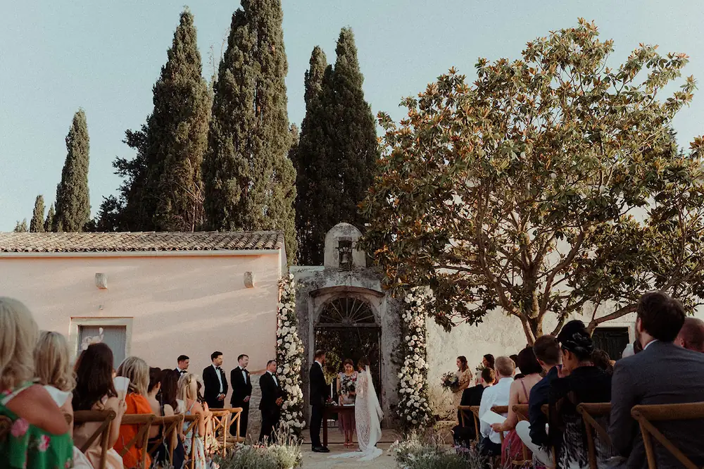 a reception at a greek outdoor church wedding with formal wedding attire