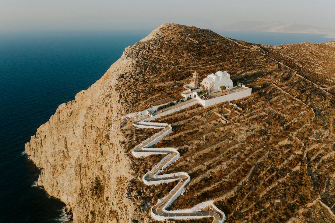 an impressive greek orthodox church on top of a mountain in folegandros island in greece