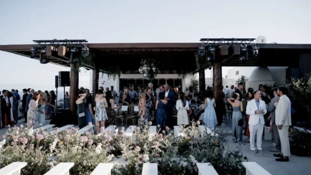 kalesma mykonos guests getting ready to sit down for wedding service
