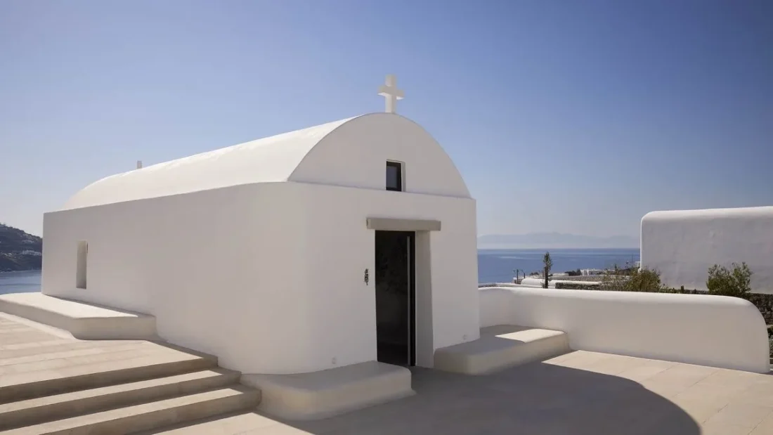 a white-washed cycladic style wedding chapel at kalesma mykonos in greece