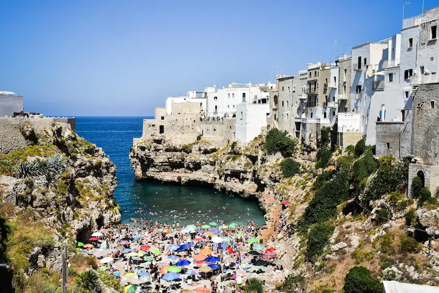 a beach view of Polignano a Mare, Italy in the Summer.