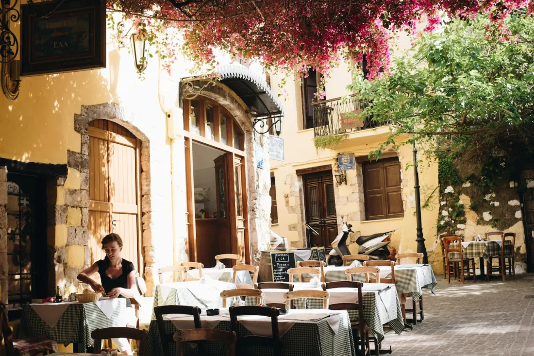 bougainvillea drapping in an alleyway in chania crete old town