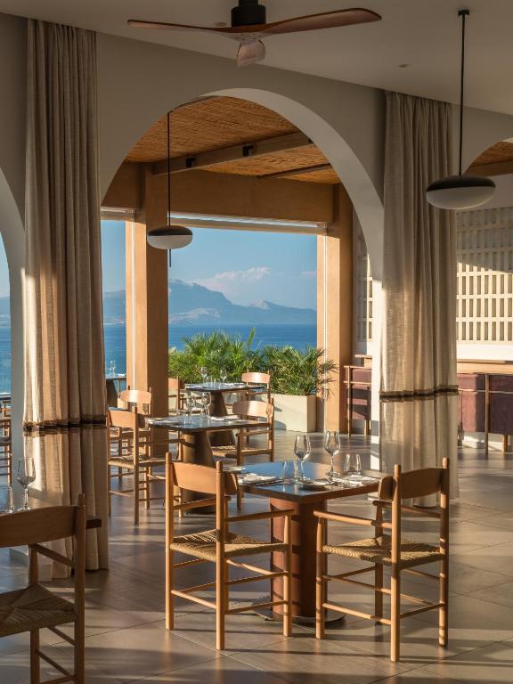 a view of the dining hall and view onto the sea at the Lindos Mare, Seaside Hotel in Rhodes