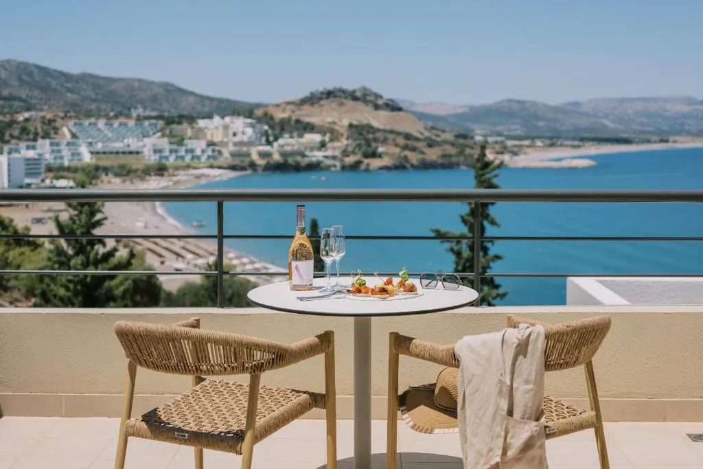 two chairs facing the sea at the Lindos Mare, Seaside Hotel in Rhodes