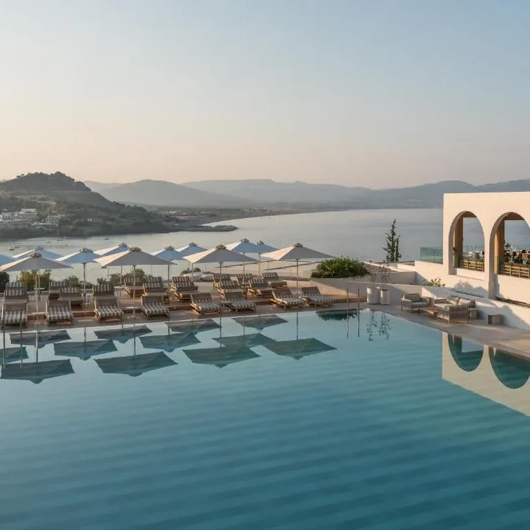 A view of the pool and the aegean sea at the Lindos Mare, Seaside Hotel in Rhodes