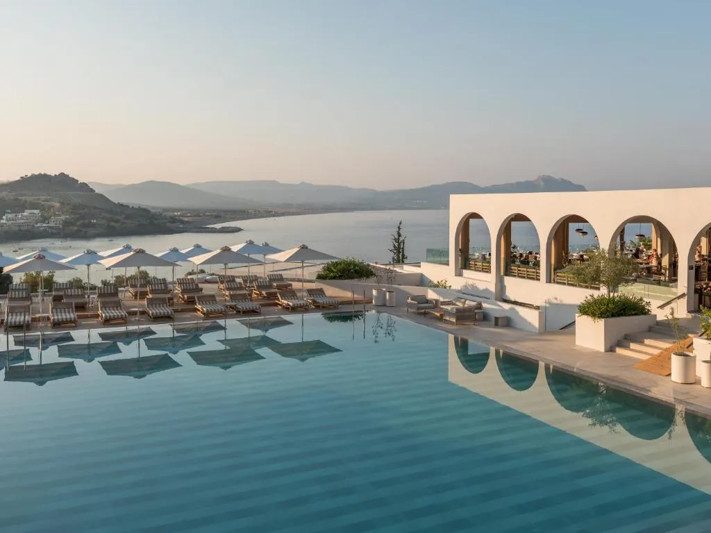 A view of the pool and the aegean sea at the Lindos Mare, Seaside Hotel in Rhodes