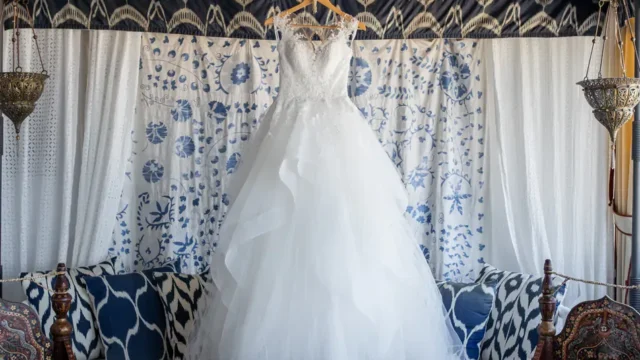 a white brides wedding dress hanging at the Melenos Art Boutique Hotel for a wedding in rhodes
