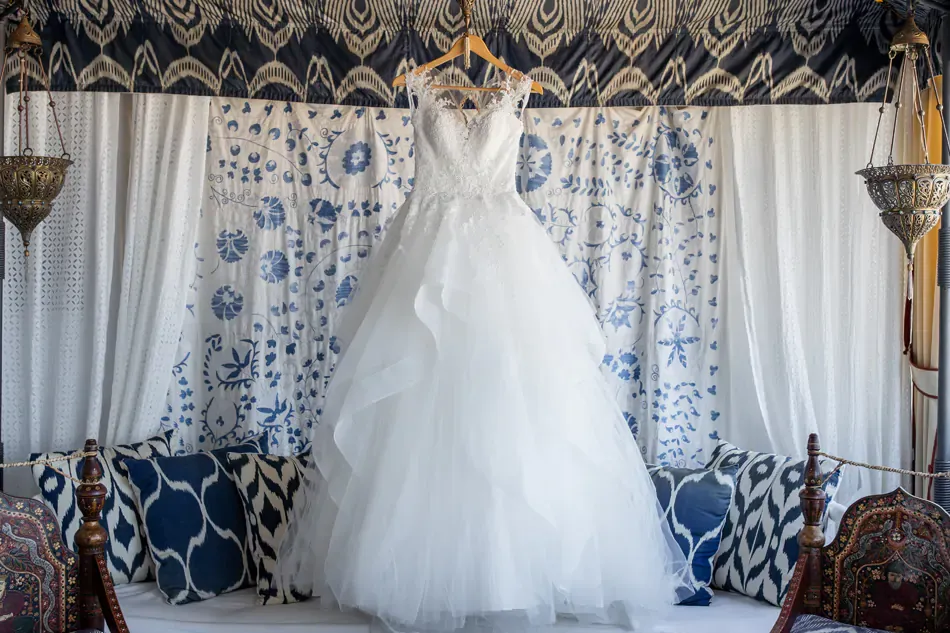 a white brides wedding dress hanging at the Melenos Art Boutique Hotel for a wedding in rhodes