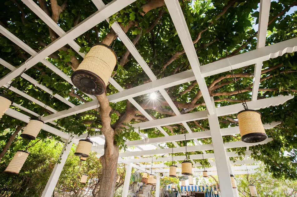 white pergola and hanging lamp at the Melenos Art Boutique Hotel setup for a wedding in rhodes