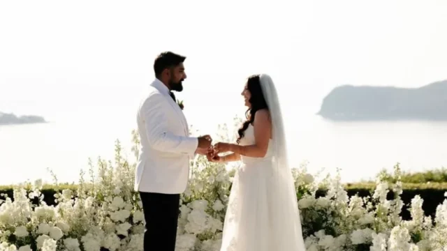 a bride and groom exchanging vows in front of the agean sea in crete