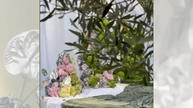 a beautiful flowered table decoration for a wedding in gree