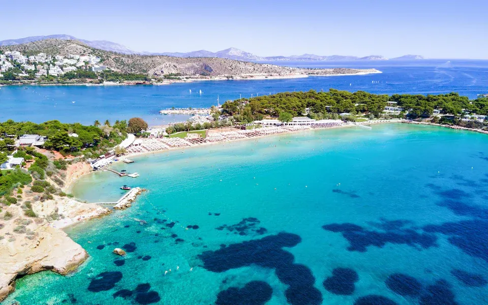 Aerial shot of the turquoise waters of the athens riviera