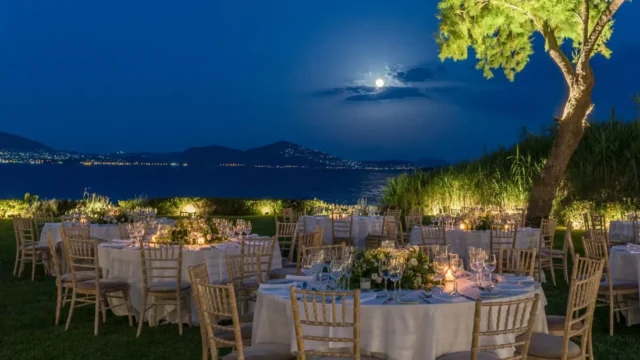 island residence wedding venue on the athens riviera at night with the moon shining at night