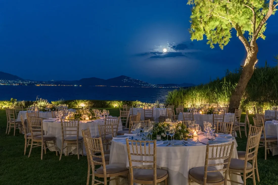 island residence wedding venue on the athens riviera at night with the moon shining at night