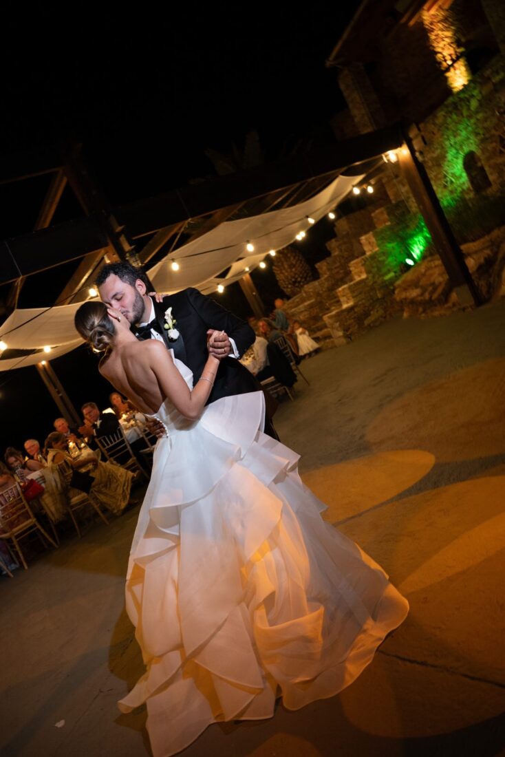 Kendall and Taylor's first dance under warm lights at their Sifnos reception
