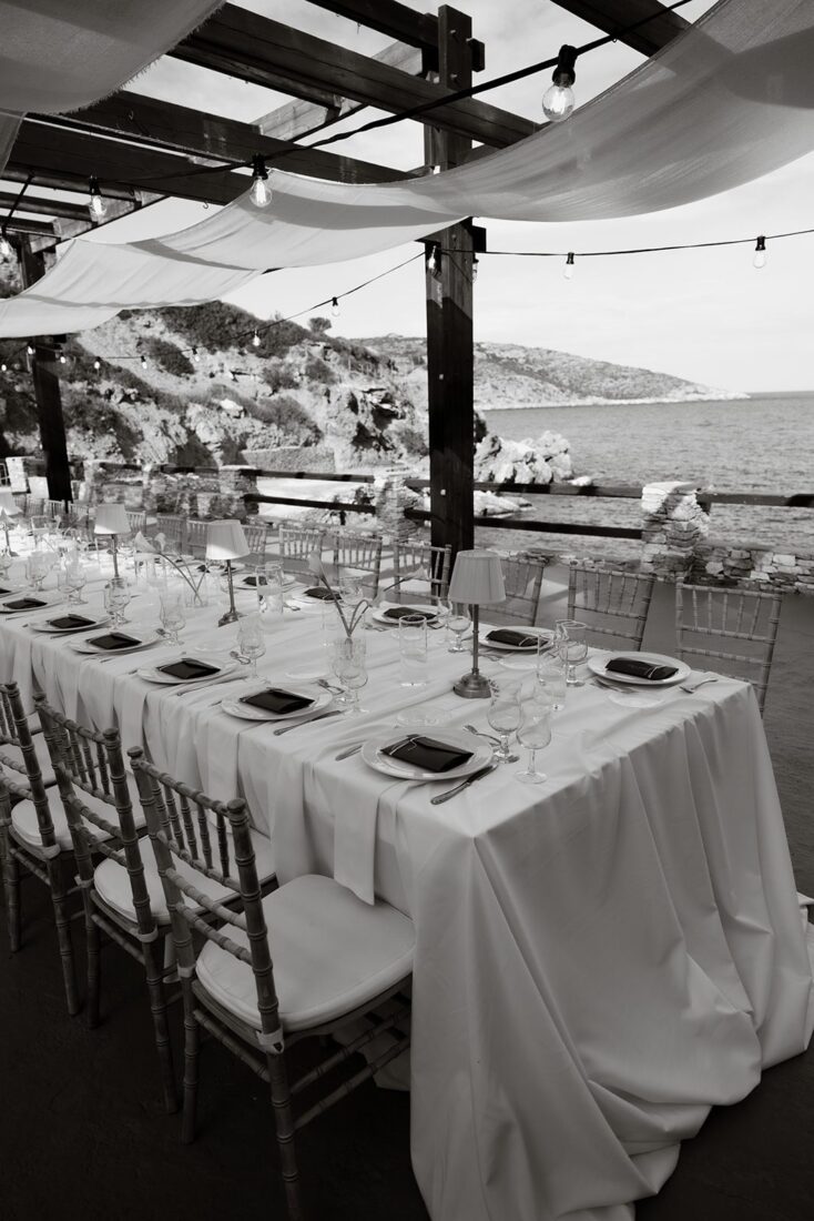 Wedding reception table overlooking the Aegean Sea at Lazarou Beach, Sifnos