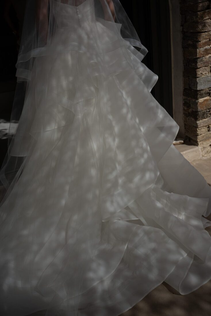 Detail of the bride's wedding dress train at a Sifnos destination wedding